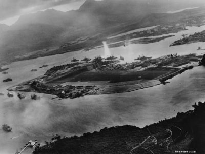 Photograph taken from a Japanese plane during the torpedo attack on ships moored on both sides of Ford Island, Pearl Harbor. U.S. Naval History and Heritage Command Photograph.
