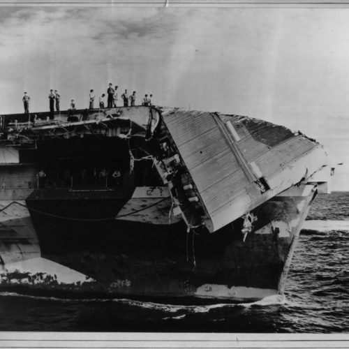 The collapse of Hornet’s flight deck bow section due to typhoon wind and water damage.