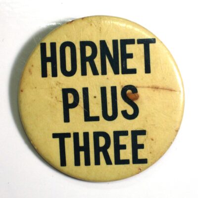 Apollo 11 pin back button made for Hornet crew.