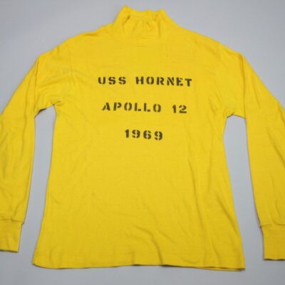 Flight deck Jersey, yellow jersey, "USS Hornet Apollo 12 1969", worn by Hangar Deck Control crewman William Stiene, 1969.