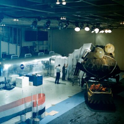 After Columbia was pulled into Hornet's Hangar Bay 2, it was connected to the Mobile Quarantine Facility (MQF) via a plastic transfer tunnel. This allowed the biological quarantine to remain in place while the astronauts and MQF technicians safely retrieved items from the spacecraft, such as the moon rocks and personal effects.

Photo by Don Blair.