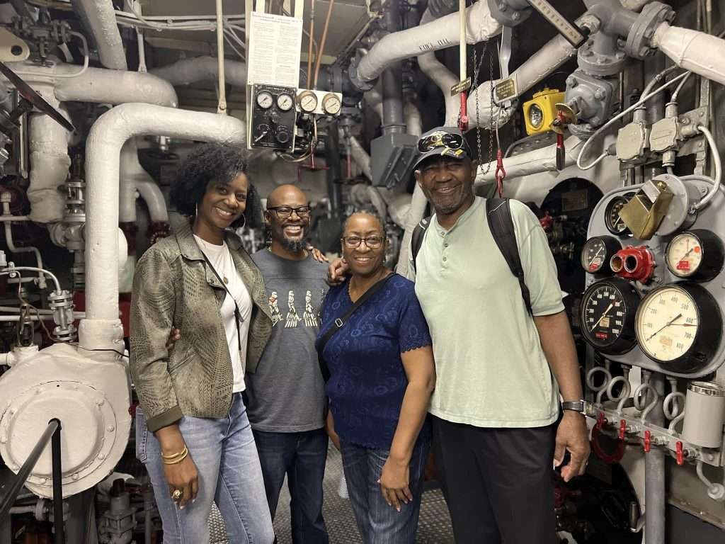 Group posing on a tour of USS Hornet