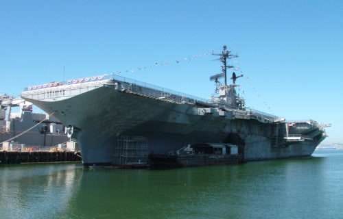 USS Hornet aircraft carrier docked at port.