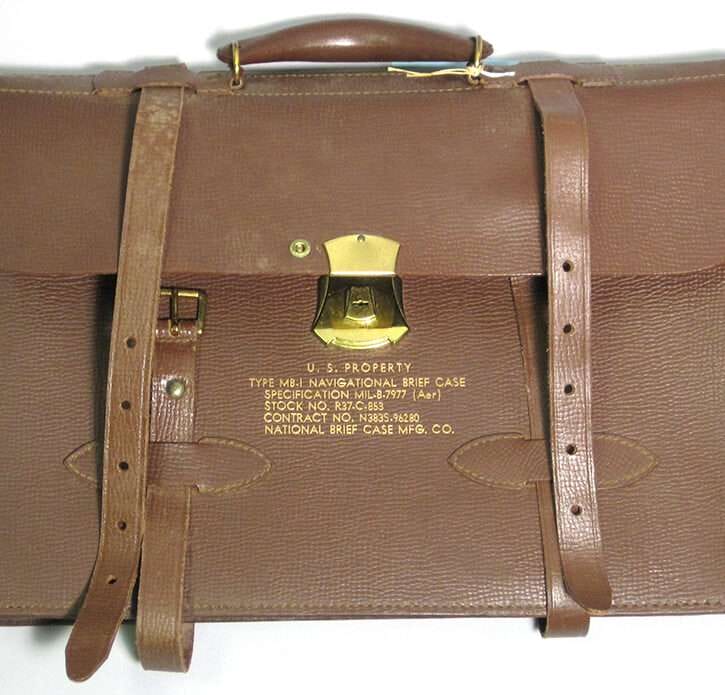 Brown leather navigational briefcase with US Navy property markings.