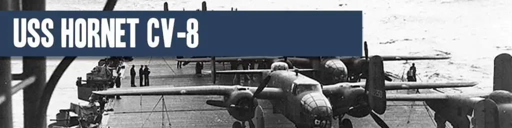 USS Hornet cv-8 banner with old war planes on hanger