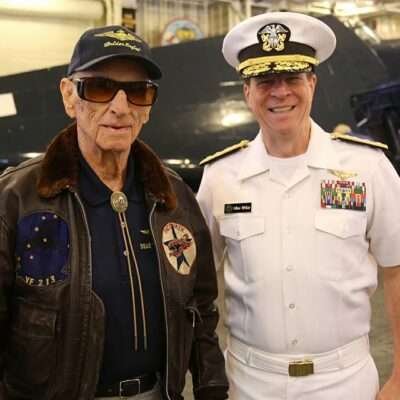 Diz Laird with Rear Admiral White at USS Hornet Museum event in 2016.