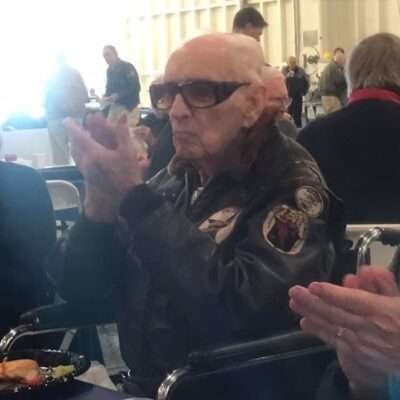 Veteran Diz Laird clapping during his 99th birthday celebration.