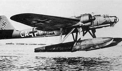 Seaplane in flight over water.