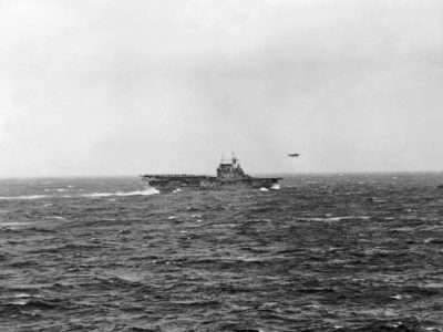 A North American B-25 Mitchell of US Army Air Corps 17th Bomb Group (Medium) is airborne from the flight deck of USS Hornet (CV-8) for the first aerial attack on Japan. Photograph taken from USS Enterprise (CV-6).