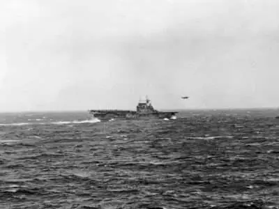 A North American B-25 Mitchell of US Army Air Corps 17th Bomb Group (Medium) is airborne from the flight deck of USS Hornet (CV-8) for the first aerial attack on Japan. Photograph taken from USS Enterprise (CV-6).