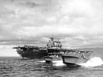 P. T. Boats escort USS Hornet (CV-8) departing Pearl Harbor following Hornets return to Pearl Harbor on 25 April, 1942 returning from the Doolittle Tokyo Raid.