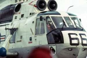 Close-up of a US Navy helicopter with the number 66 on the side.