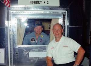 Neil Armstrong inside quarantine module, Don Stullken standing outside, Apollo 11 recovery.