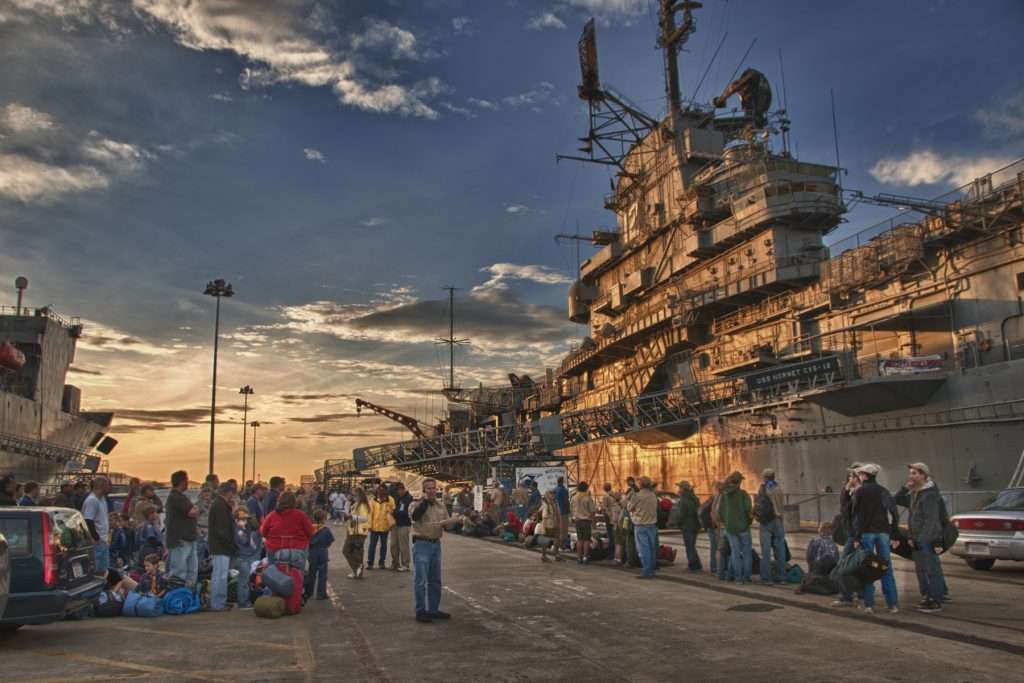 People standing outside of USS Hornet