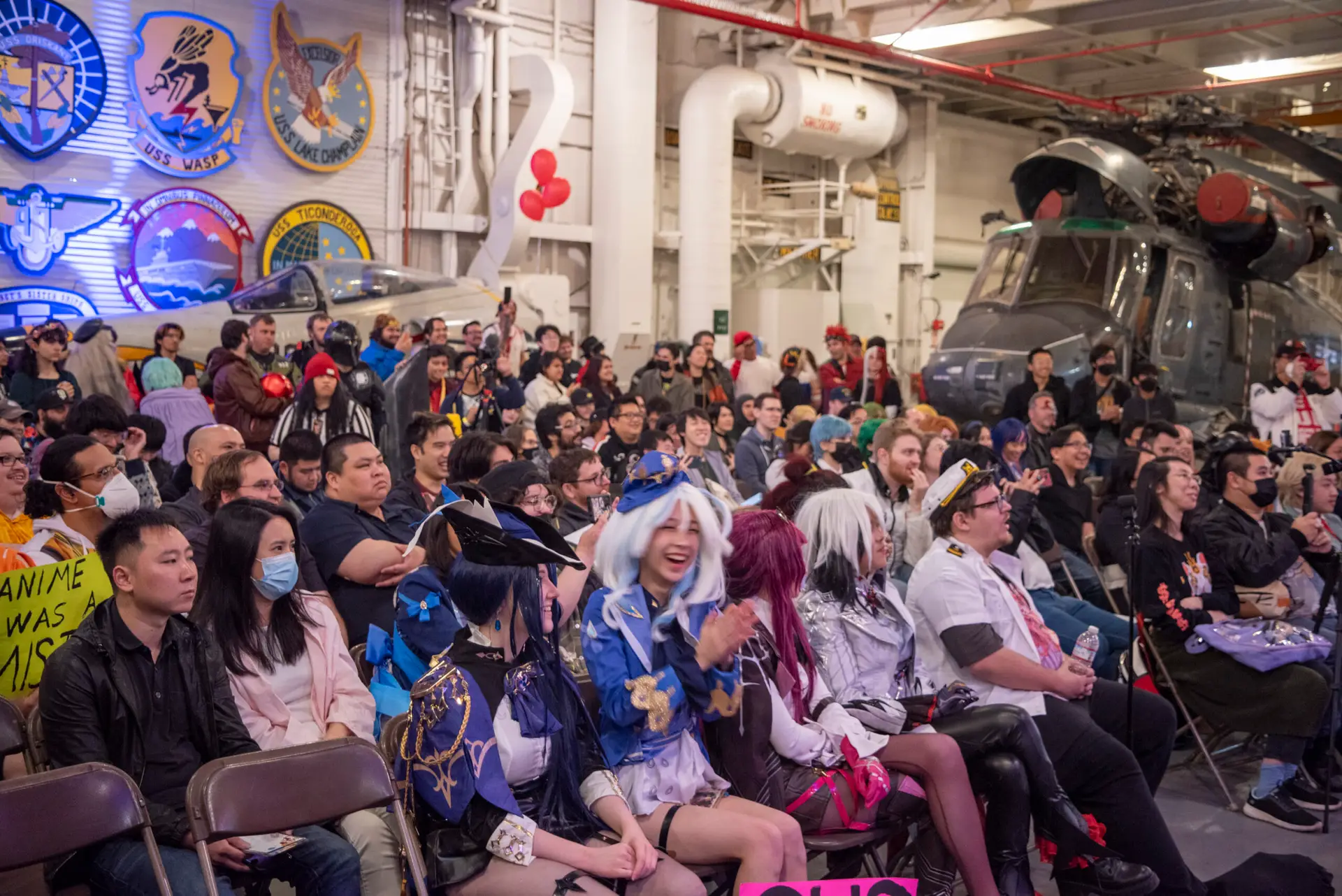 Picture of cosplayers watching a panel at CarrierCon